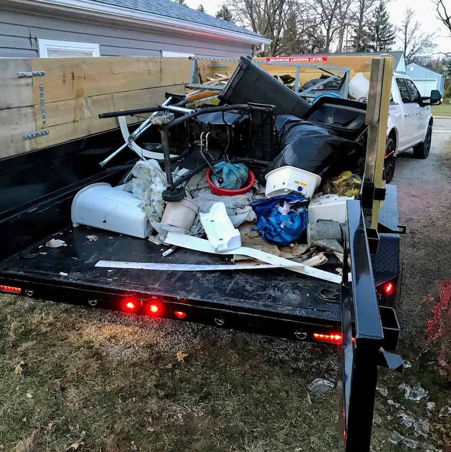 Roll-off dumpster delivered to a residential driveway in Pueblo