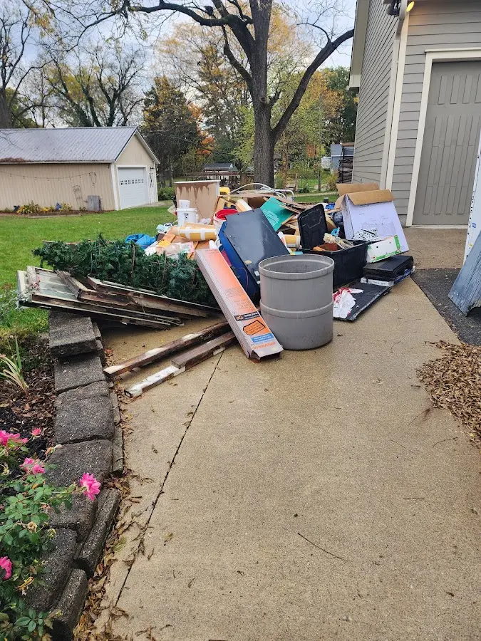 Dumpster being loaded with debris for Roofing Dumpster Rental in Pueblo